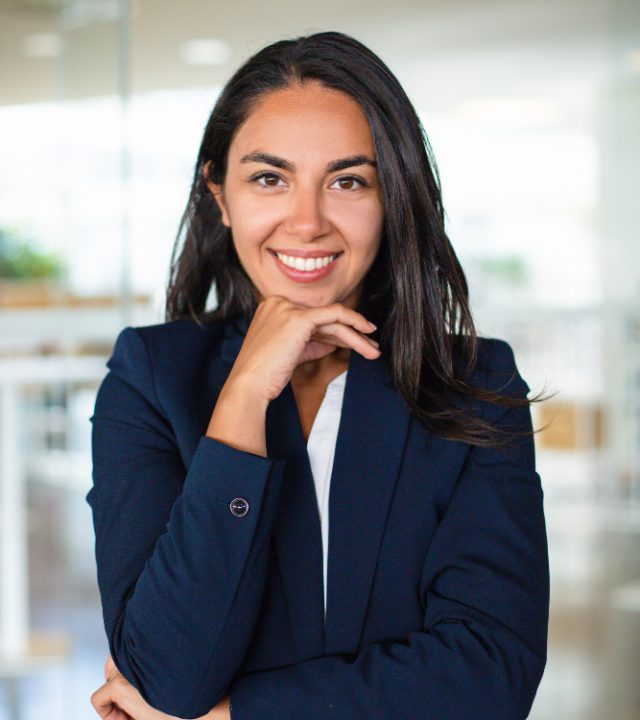 happy-businesswoman-with-hand-chin